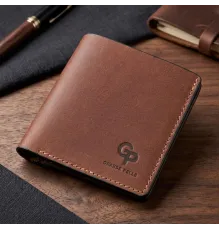 Компактне портмоне унісекс з накладної монетницьою GRANDE PELLE 11238 Коричнева