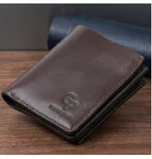 Вертикальне глянсове портмоне з накладною монетницьою GRANDE PELLE 11330 Шоколадне