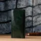Добротний гаманець у два складення з натуральної гладкої шкіри GRANDE PELLE 22945 Зелений